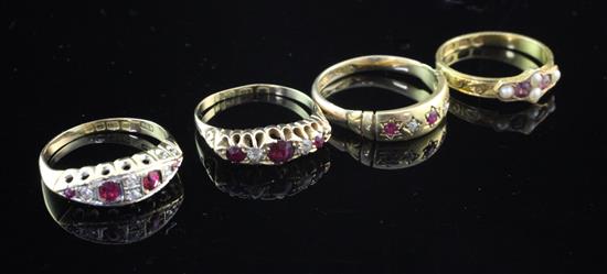 Three early 20th century 18ct gold, ruby and diamond rings and an earlier 15ct gold, amethyst and split pearl ring, various sizes.